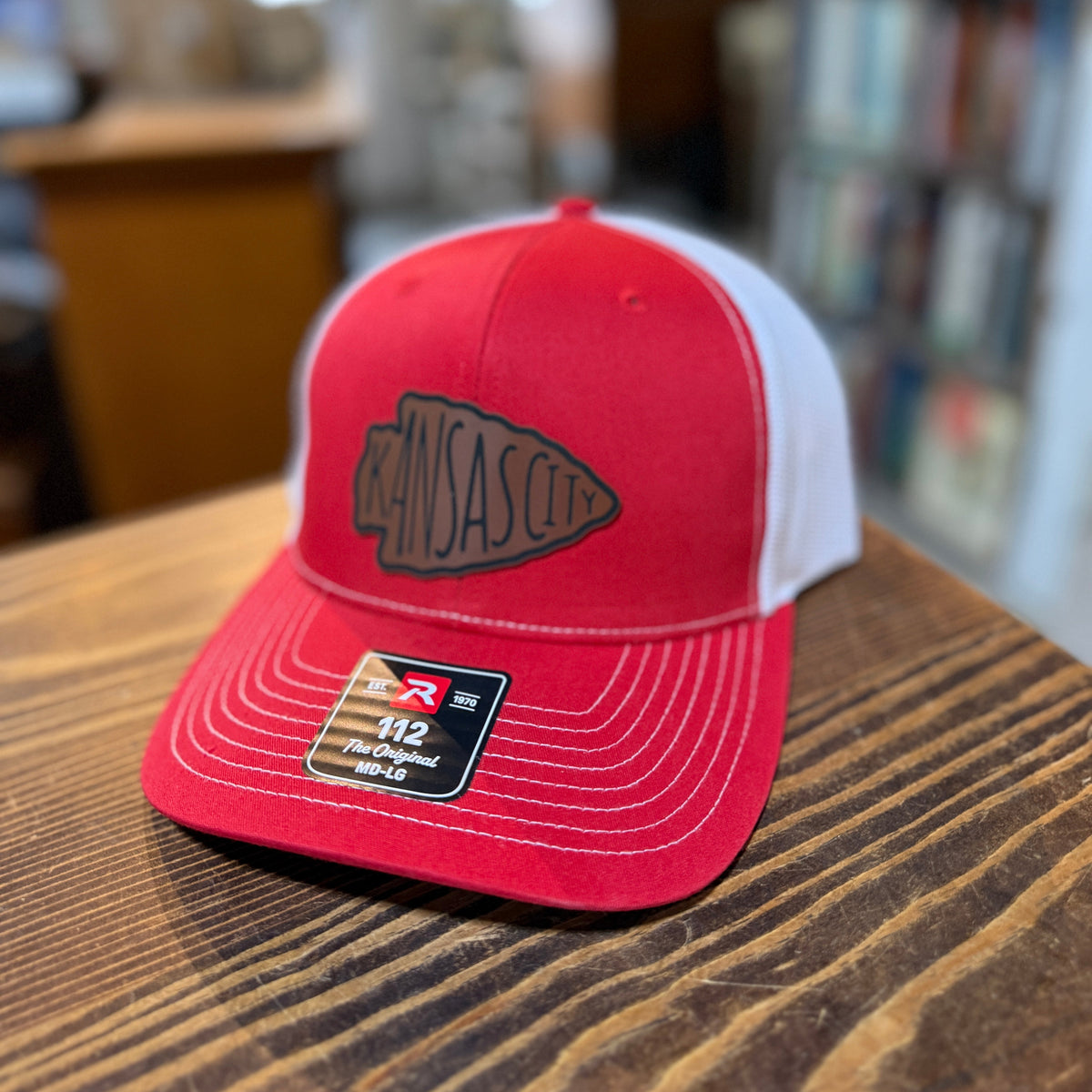 Angled view of red and white Kansas City arrowhead Richardson 112 trucker hat